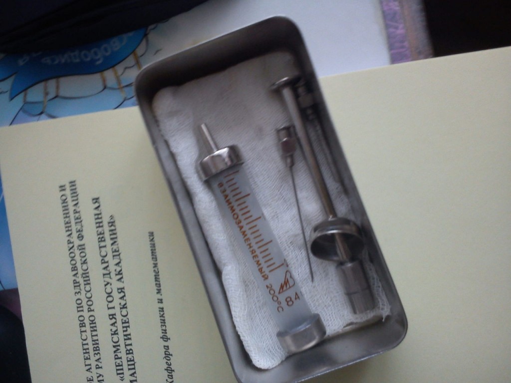 Syringe in metal container